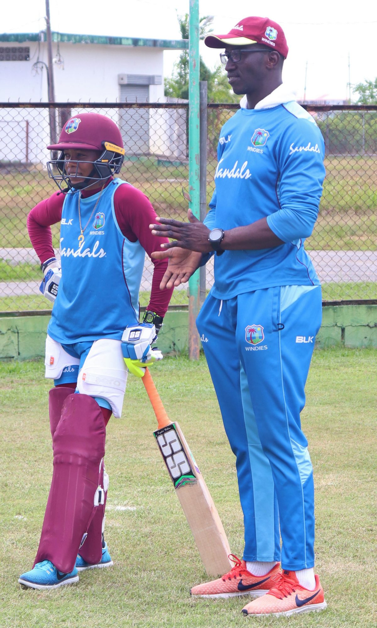 Assistant Coach Rayon Griffith in discussion with Shemaine Campbelle (Romario Samaroo photo)

