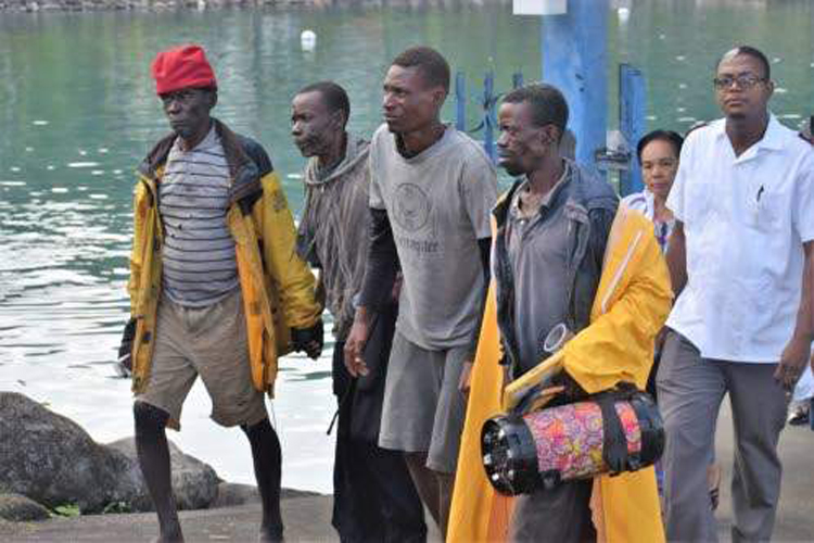 The four Haitian fishermen, who were rescued off the the coast of St Margaret's Bay in Portland yesterday, are seen here after being rehydrated. (Photo: Everard Owen)