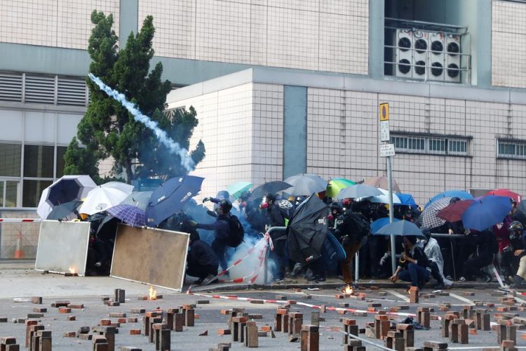 Protesters clash with riot police as they try to leave the surrounded campus of Hong Kong Polytechnic University (PolyU), in Hong Kong, China November 18, 2019. REUTERS/Thomas Peter