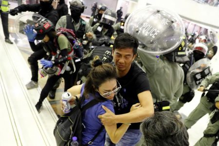 People scuffle with riot police at a shopping mall in Tai Po in Hong Kong, China November 3, 2019. REUTERS/Kim Kyung-Hoon