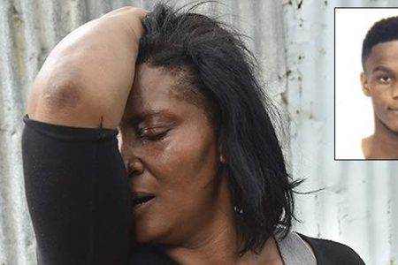 Alisia Beckford cries as she recalls the brutal murder of her 16-year-old son, Justin Foster, at her house in Harbour View yesterday morning as they were preparing for church. (Photo: Norman Thomas)