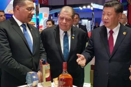 Prime Minister Andrew Holness (left) with Chinese President Xi Jingping at the 2019 China International Import Expo being held in Shanghai, China, on Tuesday, November 5. Also present is Industry and Commerce Minister Audley Shaw (centre).