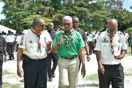 President David Granger (centre) in a conversation with the President of the Scout Association of Guyana Ramsay Ali. They are accompanied by the Chief Commissioner of the Scout Association of Guyana Andrew Ramcharitar. (Ministry of the Presidency photo)