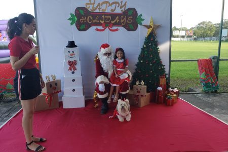 Santa Paws? Madeline and her dog Bella with Santa Paws at the Paws for a Cause ‘Christmas Market’ yesterday at the Georgetown Cricket Club Ground. See story on page 21.  