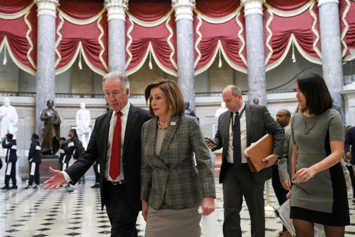 U.S. House Speaker Nancy Pelosi (D-CA) walks through Statuary Hall with House Ways and Means Committee Chairman Richard Neal (D-MA) on Capitol Hill in Washington, U.S., December 6, 2019. REUTERS/Loren Elliott