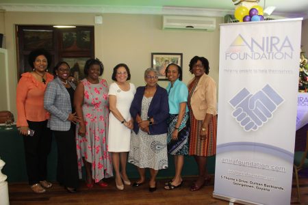 First Lady Sandra Granger (at centre) with some of members of the ANIRA Foundation’s Board of Directors. From left are Karen Abrams, Michelle Johnson, Ingrid Fung, Mrs Granger, Evelyn Hamilton, Sister Julie Mathews and Lieutenant Colonel Yvonne Smith. (ANIRA Foundation photo) 