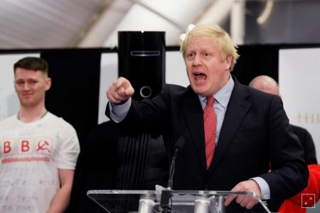 Conservatives’ British Prime Minister Boris Johnson gestures while speaking after winning his seat at the counting centre in Britain’s general election in Uxbridge, Britain, today. (REUTERS/Toby Melville)