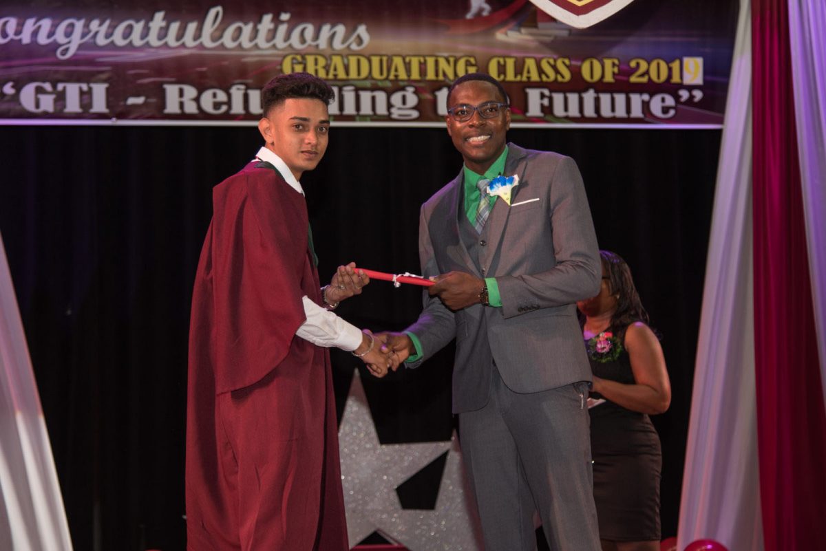 Valedictorian Feezal Dhanny receiving his certificate at GTI’s 68th Convocation Ceremony (DPI photo) 