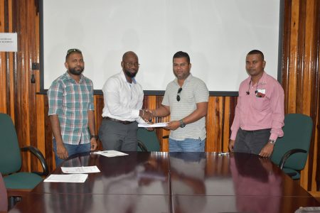 From left are CEMCO Engineer Devraj Deonarine, BNTF Project Manager Dikedemma Utoh, General Manager of R. Kissoon and Son Contracting Services Rudranauth Roopdeo and Executive Director of Hinterland Services at GWI Ramchand Jailal following the signing of the contracts for the Fly Hill and Kwaimatta projects. (GWI photo) 