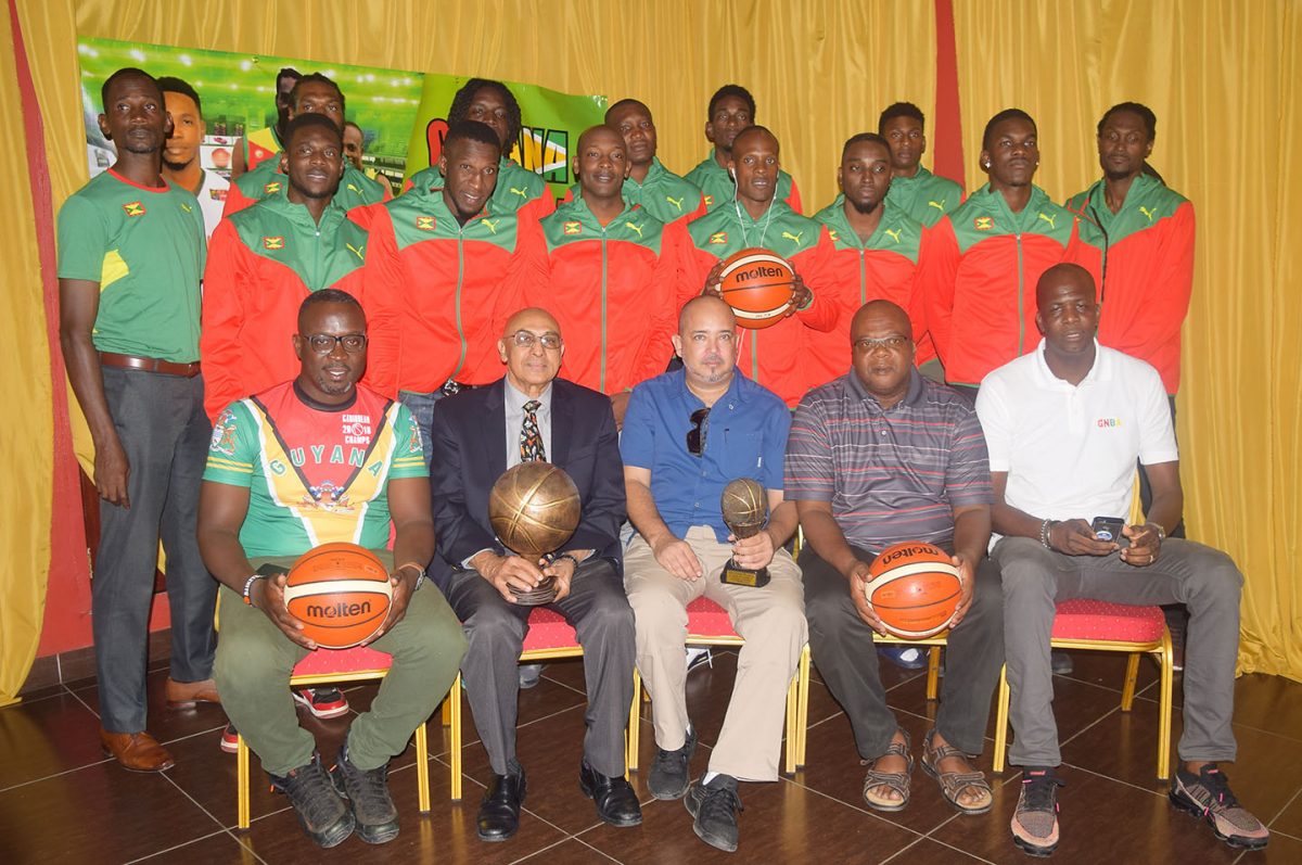 Members of the Grenada National Men’s Basketball Team posing for a photo following their arrival on local shores. Also in the photo, sitting from left to right, are Guyana Head Coach Junior Hercules, GOA President Kalam Juman-Yassin, GABF President Michael Singh, Grenada Head Coach Naka Joseph and Grenada National Basketball Association Treasurer Rondell Johnson.
