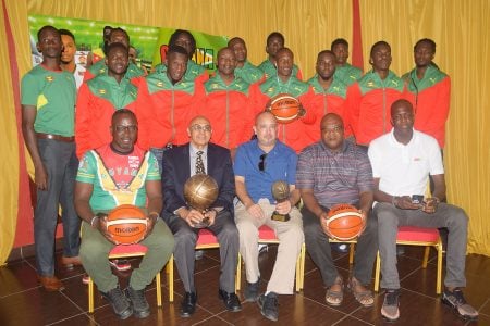 Members of the Grenada National Men’s Basketball Team posing for a photo following their arrival on local shores. Also in the photo, sitting from left to right, are Guyana Head Coach Junior Hercules, GOA President Kalam Juman-Yassin, GABF President Michael Singh, Grenada Head Coach Naka Joseph and Grenada National Basketball Association Treasurer Rondell Johnson.
