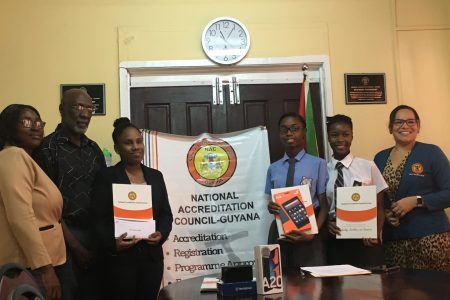 Prize winners with Members of the National Accreditation Council