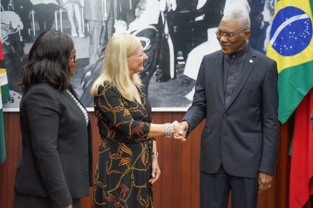 President David Granger greets Her Excellency Maria Clara Duclos Carisio, Ambassador of the Federative Republic of Brazil to the Cooperative Republic of Guyana (centre), as Minister of Foreign Affairs, Dr. Karen Cummings (left) looks on. (Ministry of the Presidency photo) 