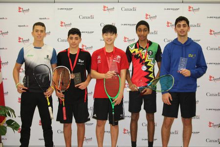 Shomari Wiltshire (second from right) posing with winner Canadian Gabriel Yun (centre) along with the other top finishers in the U17 section of the Canadian Junior Squash Open championship at the White Oaks Conference Centre, Niagara, Canada. (Squash Canada photo)
