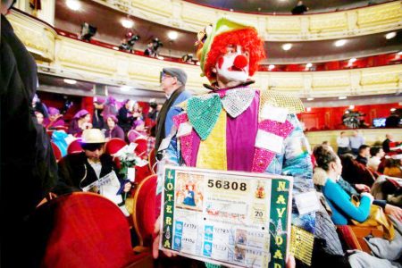 A man shows a photocopy of a lottery ticket, as he attends the draw of Spain’s Christmas Lottery “El Gordo” (The Fat One) in Madrid, Spain, on December 22nd, 2018. (REUTERS/Javier Barbancho file photo) 