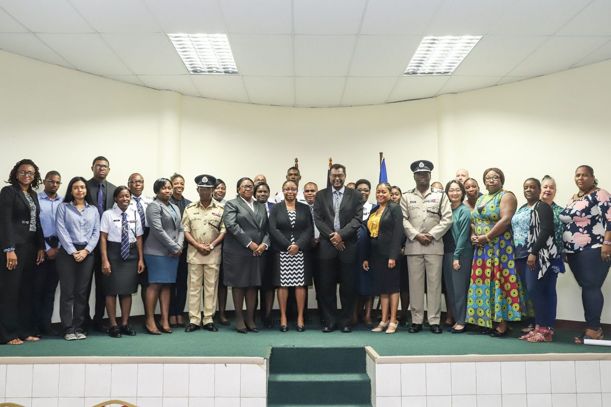 Public Security Minister Khemraj Ramjattan (seventh, from right) along with various stakeholders yesterday at the launching of the SOPs for the investigation and prosecution of TIP cases in Guyana. 