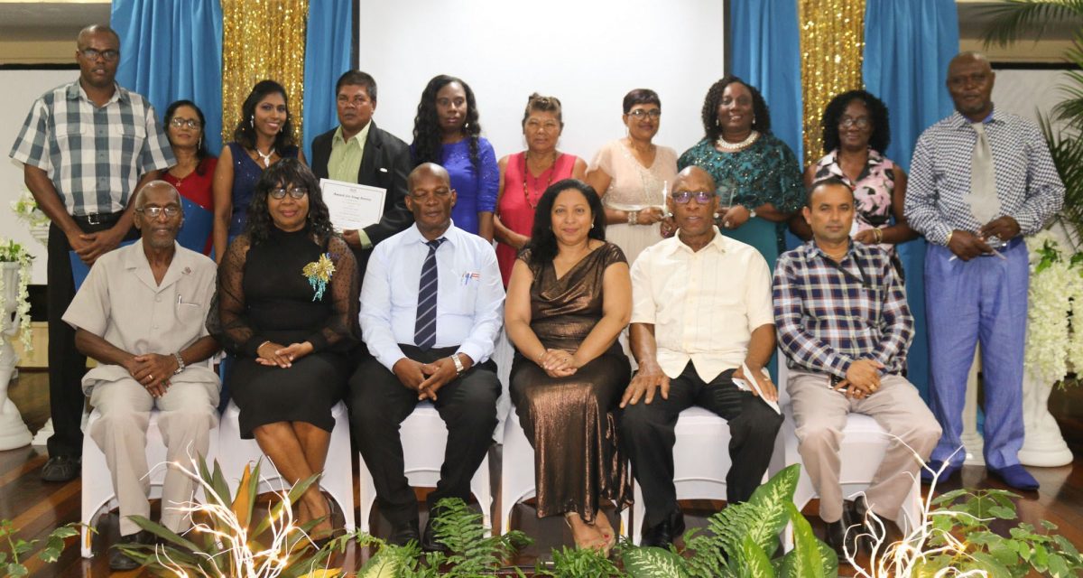 Back row: Long Service Awardees and seated are members of the Transitional Management Committee (UG photo)