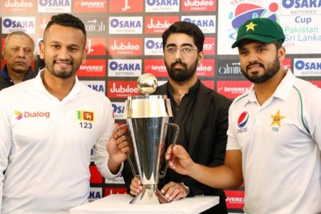 The cricket team captains Sri Lanka’s Dimuth Karunaratne and Pakistan’s Azhar Ali pose with Test series trophy ahead of the first Test cricket match between Pakistan and Sri Lanka at Pindi Cricket strating today at Stadium Rawalpindi, Pakistan. REUTERS/Stringer
