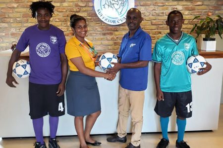 Timehri Panthers VP/PRO Mr. Clayton A. D Lambert receives one of the balls from Bounty Farm Ltd. Employee Ms. Amelia Kellman in the presence of Mr. John Steele (left) and Senior Captain Mr. Shannon Samnauth, both donning the Kits.
