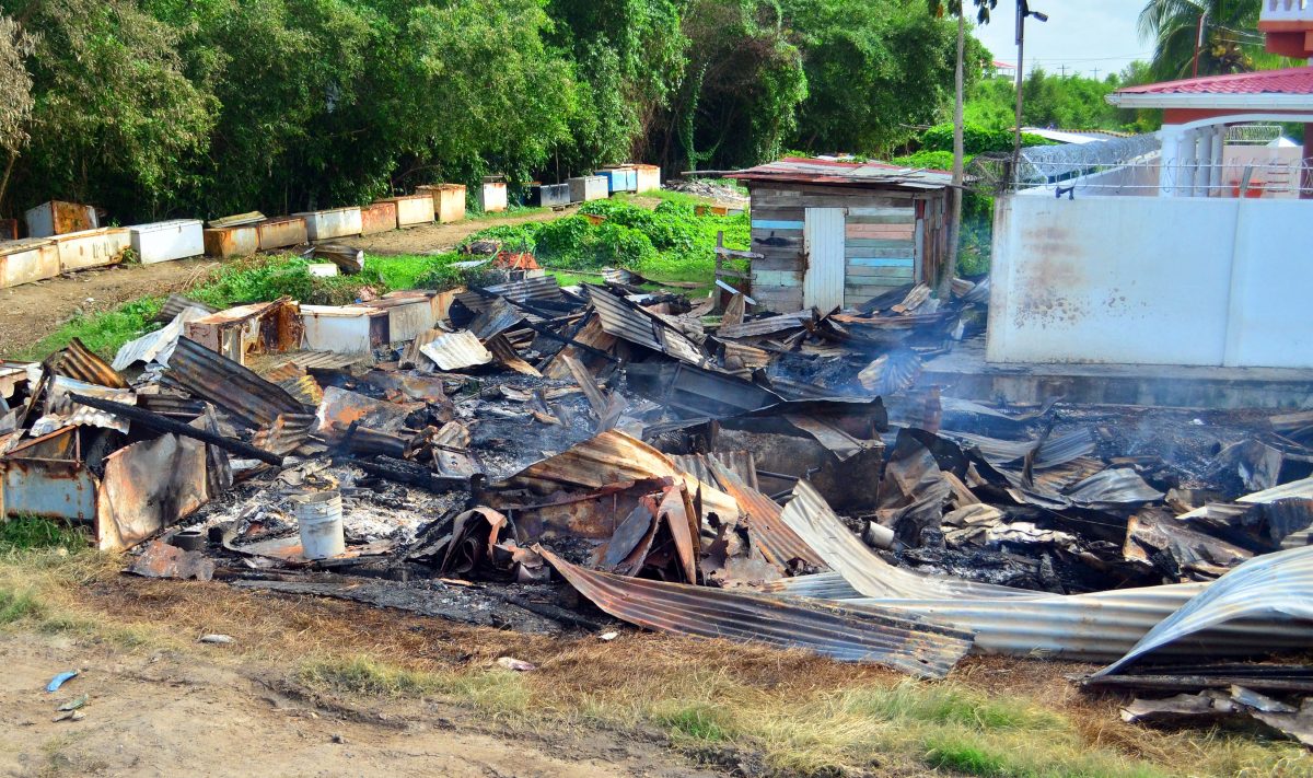 The remains of the shacks that were destroyed by the fire. (Orlando Charles photo)
