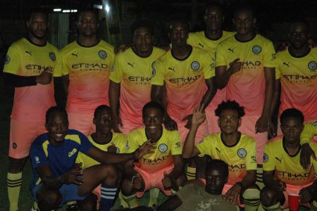 The victorious Friendship side [orange] following their win over Paradise in the inaugural 592 Beer Inter-Village Football Festival at the Golden Grove Community Centre ground
