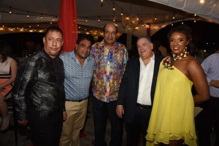 IN THE PARTY: Police Commissioner Gary Griffith, from left, Oropouche East MP Dr Roodal Moonilal, Caroni East MP Dr Tim Gopeesingh, ANSA McAL executive chairman A Norman Sabga and Nicole Dyer-Griffith at the Commissioner’s end-of-year cocktail reception on Saturday night at the Commissioner’s residence, Western Main Road, St James.  —Photo: CURTIS CHASE