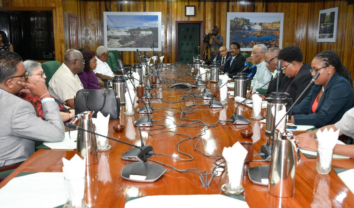 The government side (right) meeting with GECOM yesterday. (Ministry of the Presidency photo)