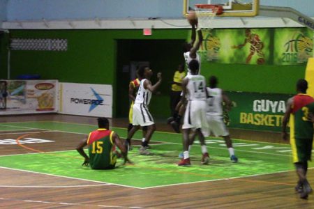  A scene from the Guyana and Grenada clash at the Cliff Anderson Sports Hall on the opening night of the Goodwill International Basketball Series
