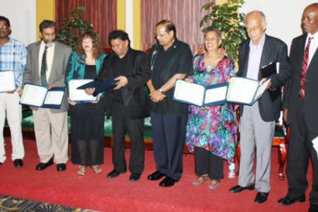 Some prize winners pose with Prime Minister Moses Nagamootoo in 2015. From left are Subraj Singh, Stanley Niamatali, Maggie Harris, David Dabydeen, Nagamootoo, Barbara Jenkins, Eddie Baugh, and Al Creighton, who represented Harold A Bascom (Stabroek News file photo)