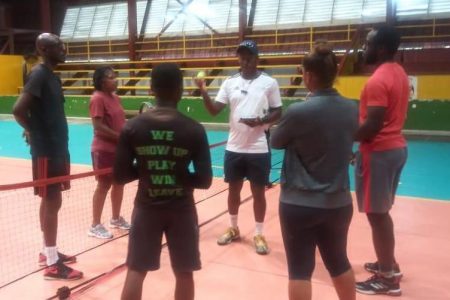 Mr. Damien Applewhaite interacts with local coaches during one of the sessions.