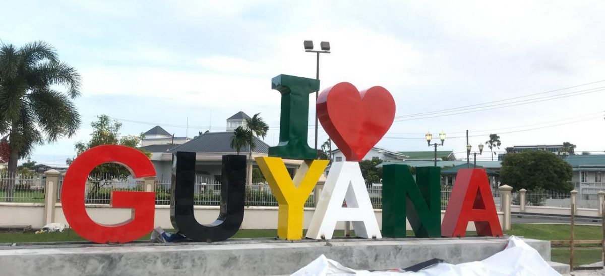 This soon to be launched `I love Guyana’ sign was erected on Saturday and has already generated much interest on social media. The sign is located opposite the Umana Yana.  
The sign which is 12 feet in height by 34 feet in width has been constructed by the Tourism and Hospitality Association of Guyana (THAG) in partnership with Impressions Inc and GBTI.
THAG in a press release said the location will serve as a gathering point for visitors who desire to celebrate their travel here.  “It may as well be used as a starting or culmination point for tours across the city as well as outer lying locations,” THAG said.