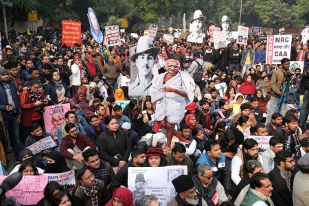 Demonstrators march during a protest against a new citizenship law in New Delhi on Dec. 24. Photographer: T. Narayan/Bloomberg