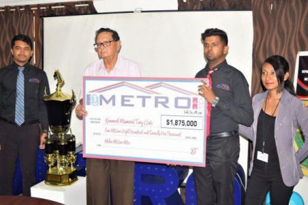 Representatives of Metro Office and Computer Supplies presented a cheque worth $1,875,000 and the champion’s trophy to President of the Club, Cecil Kennard to aid towards the traditional Boxing Day event.