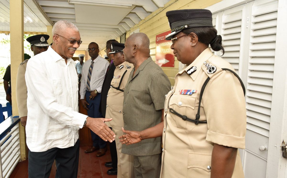 President David Granger greeting Deputy Commissioner of Police,  Maxine Graham at the Police Headquarters, yesterday morning. (Ministry of the Presidency photo)
