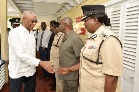 President David Granger greeting Deputy Commissioner of Police,  Maxine Graham at the Police Headquarters, yesterday morning. (Ministry of the Presidency photo)
