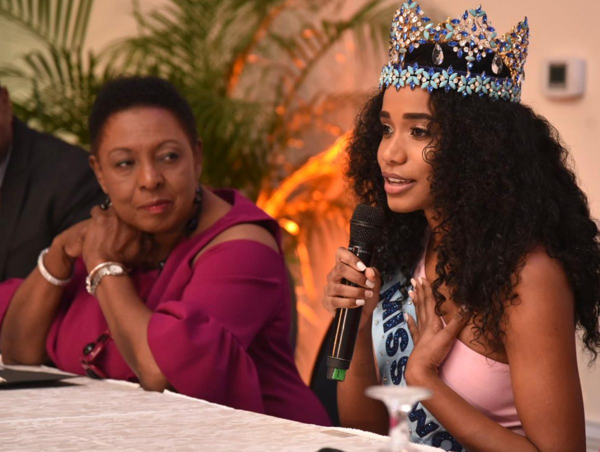 Minister of Culture, Gender, Entertainment and Sport, Hon. Olivia Grange (left), looks to Miss World 2019, Toni-Ann Singh