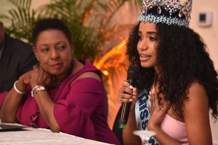Minister of Culture, Gender, Entertainment and Sport, Hon. Olivia Grange (left), looks to Miss World 2019, Toni-Ann Singh