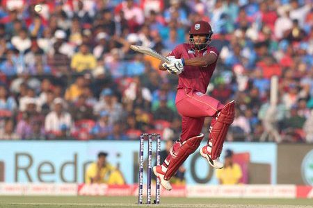 An airborne Nicholas Pooran pulling for a boundary during his top score of 89 for the West Indies