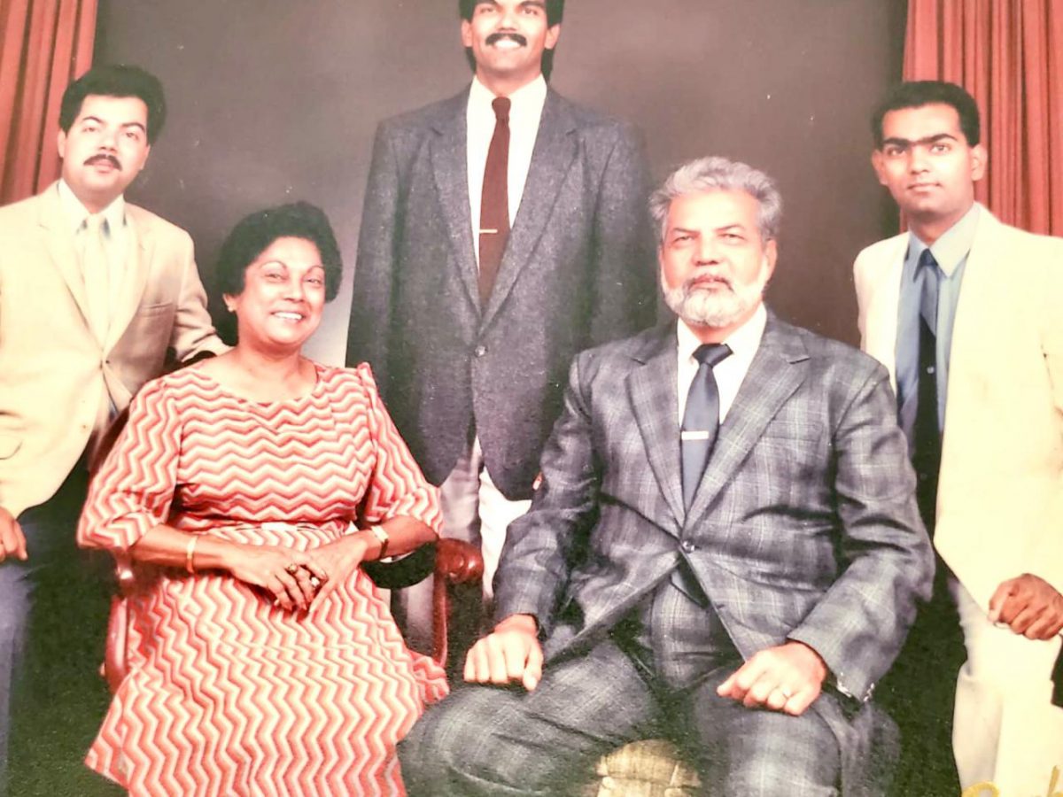 A family portrait of Fazeel Rayman and his wife, Philomena (seated) with their three sons.