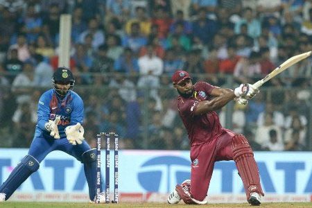 Kieron Pollard goes long during his half-century against India in yesterday’s third T20 International. 
