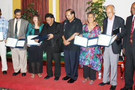 Some prize winners pose with Prime Minister Moses Nagamootoo (fourth from right) in 2015. From left are Subraj Singh, Stanley Niamatali, Maggie Harris, David Dabydeen, Barbara Jenkins, Eddie Baugh, and Al Creighton, who represented Harold A Bascom (Stabroek News file photo)