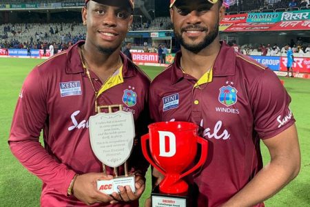 Shimron Hetmyer, left and Shai Hope are all smiles after they both scored centuries yesterday to help the West Indies thrash India and take a 1-0 lead in the  three-match, limited overs series.
