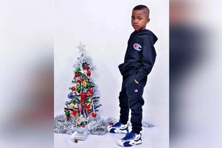 Davinee Smith, 6, poses for a photograph at his home on Wednesday, Christmas Day. He died in a fire yesterday.