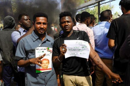 Sudan citizens gathered outside of the court (Reuters photo)