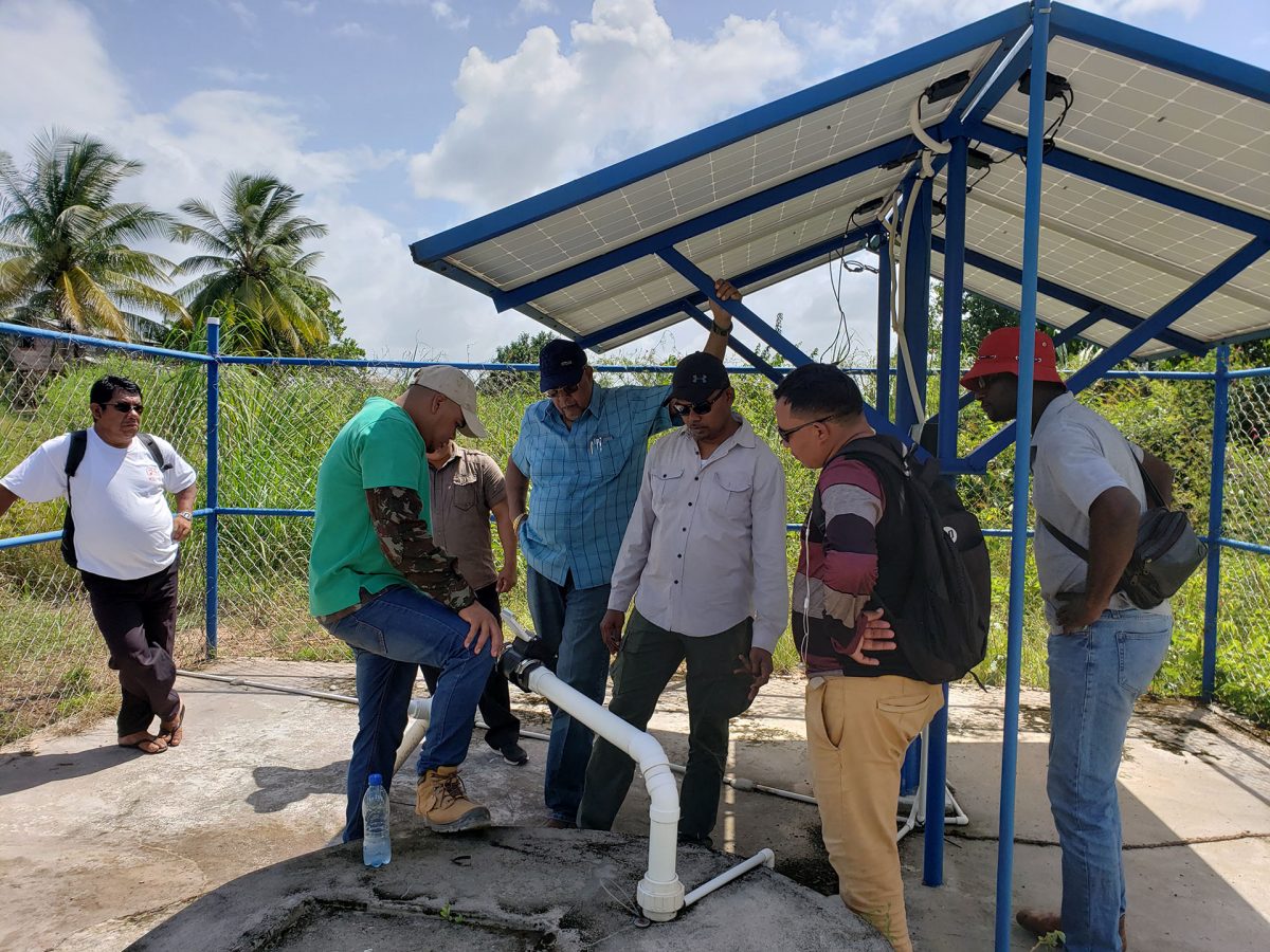 Dr. Van West-Charles addressing villagers in Crashwater (GWI photo)