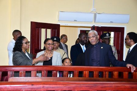 Chancellor (ag) Yonette Cummings-Edwards (front left) shows President David Granger (front right) around the new court, while Chief Justice (ag) Roxane George, (front centre) looks on.