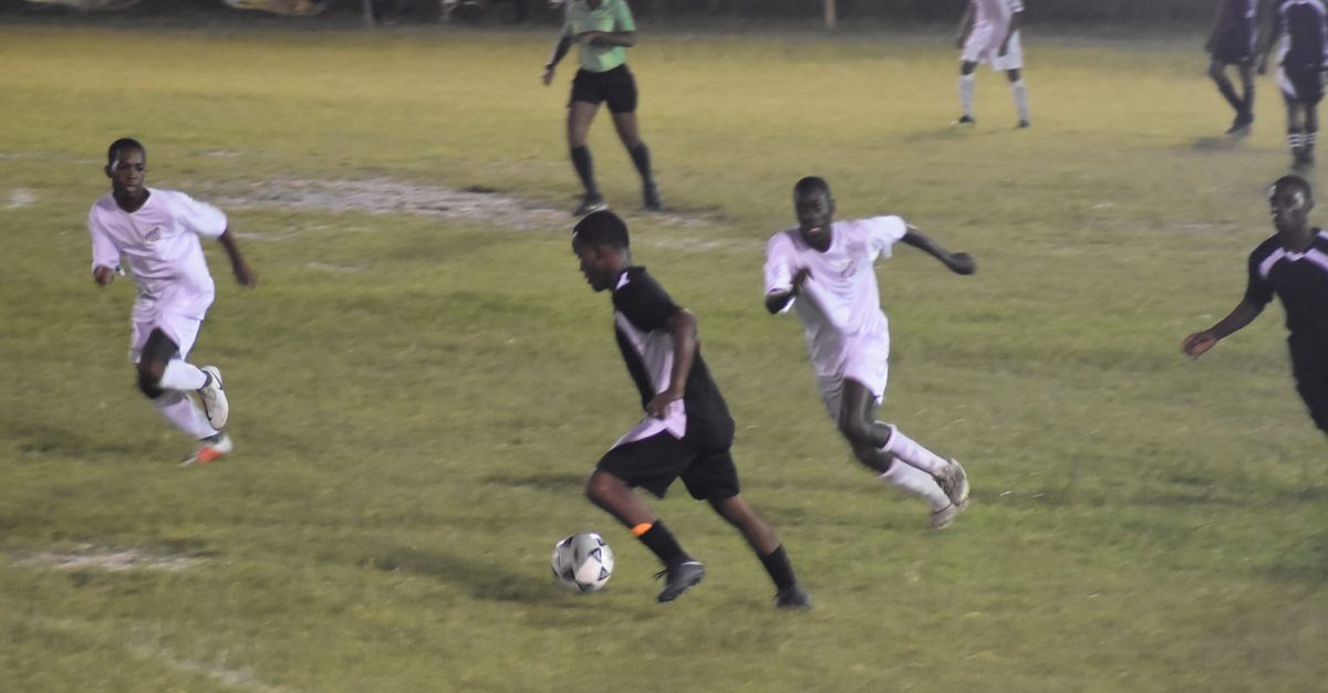 Santos and Black Pearl players battle for the ball in their clash on Wednesday. 
