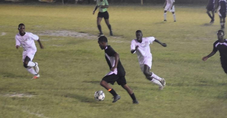Santos and Black Pearl players battle for the ball in their clash on Wednesday. 