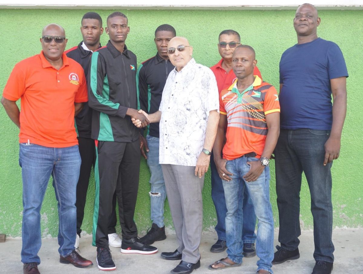 The departing contingent along with President of the Guyana Olympic Association (GOA) K. Juman-Yassin, President of the Guyana Boxing Association and others pose for a photo yesterday prior to departure. (Emmerson Campbell)
