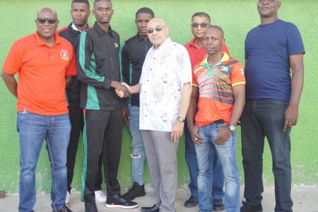The departing contingent along with President of the Guyana Olympic Association (GOA) K. Juman-Yassin, President of the Guyana Boxing Association and others pose for a photo yesterday prior to departure. (Emmerson Campbell)
